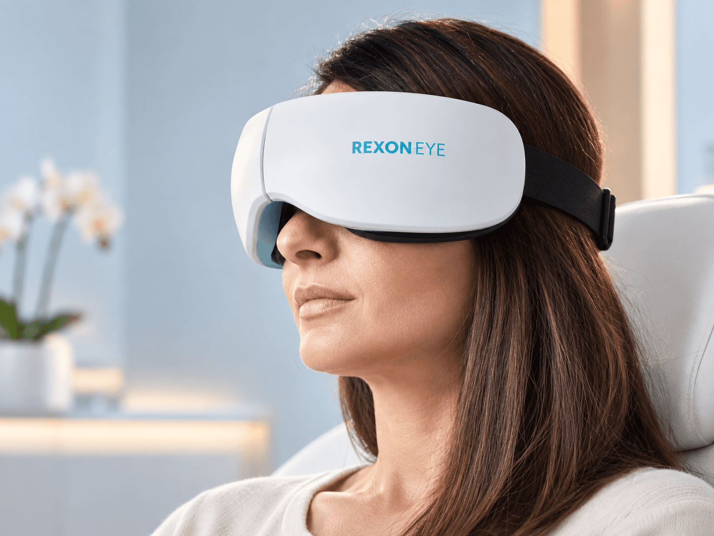 Patient receiving REXON-Eye QMR treatment for dry eye at X-Vision